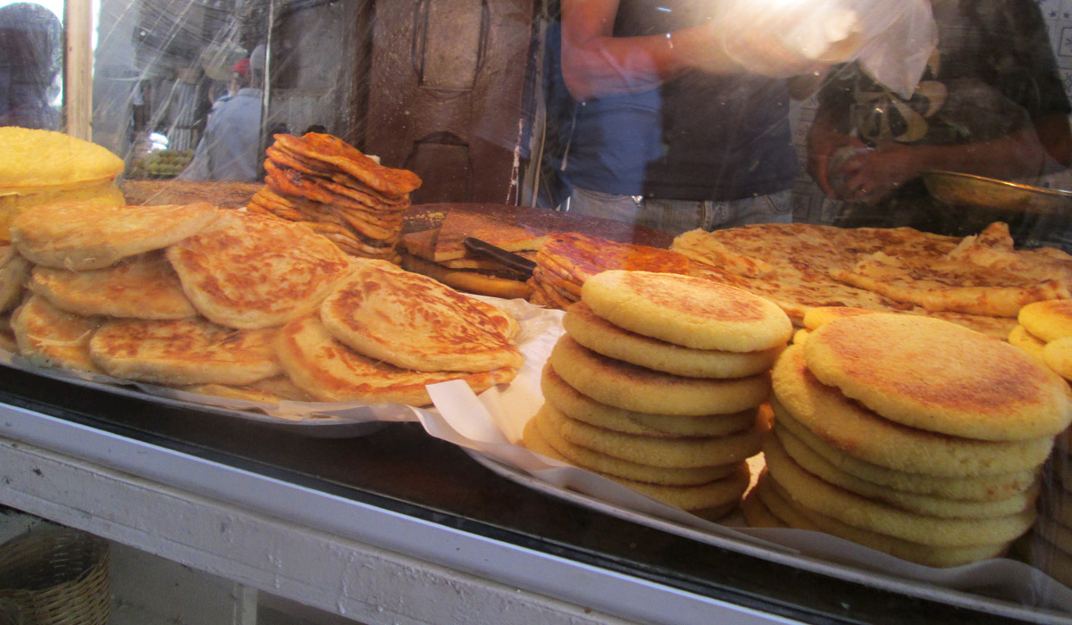 Moroccan breakfast foods including msemen, beghrir, and meloui