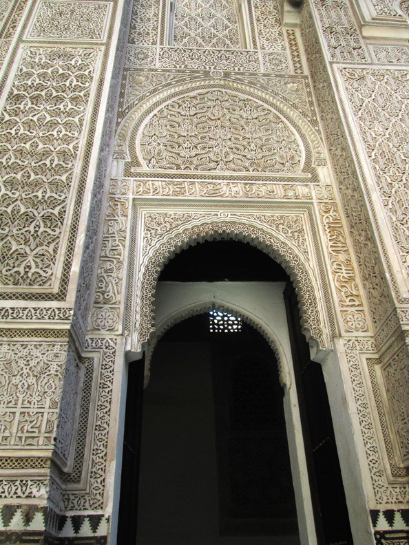 Arabesque designs on the walls of the Medersa Bou Inania in Meknes Morocco