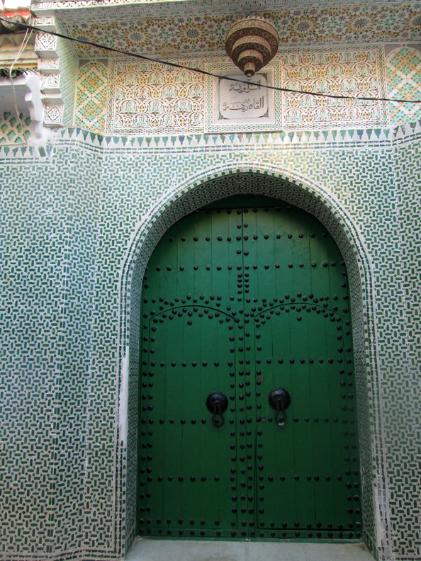 Zellige tiles and a green door at the mosque in Chefchaouen Morocco